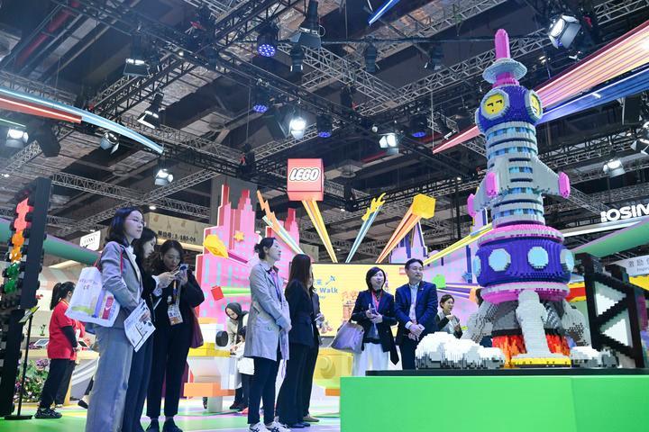 People visit the booth of Lego, an eight-year attendee of the China International Import Expo (CIIE), during the eighth CIIE in east China's Shanghai, Nov. 7, 2025. (Xinhua/Chen Haoming)